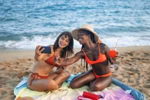 Two women having fun on the beach