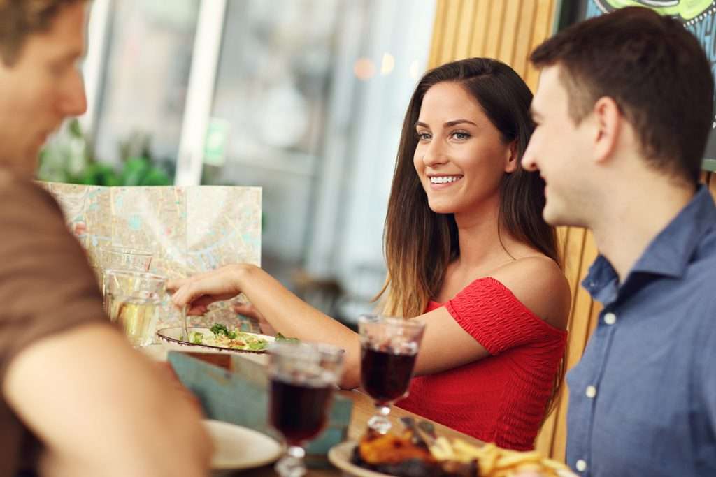 A group of customers eating in a restaurant