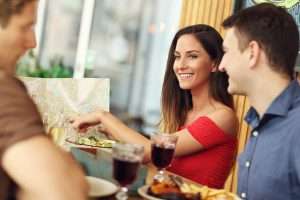 A group of customers eating in a restaurant