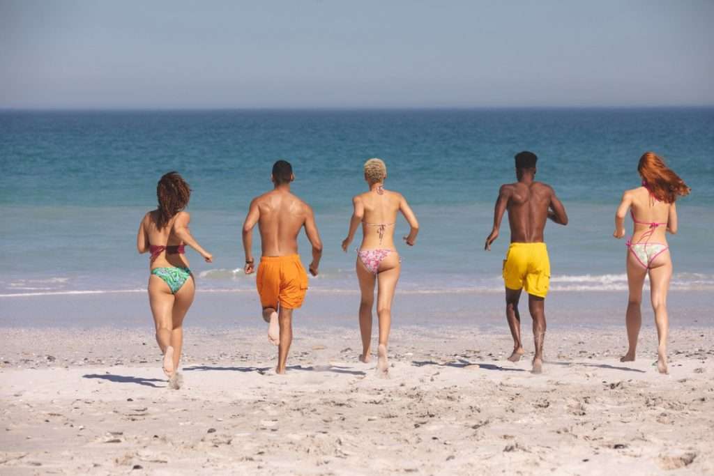 A group of people having fun on a beach