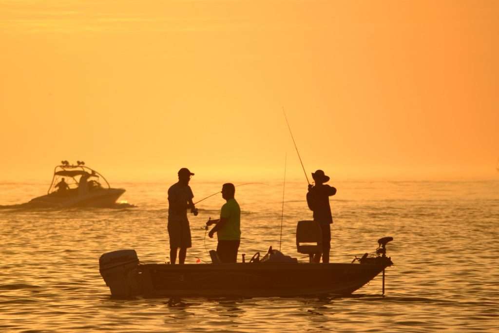 A group of men fishing on a boat